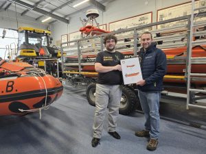 Scott presenting an artwork to Southport Offshore Rescue Trust.