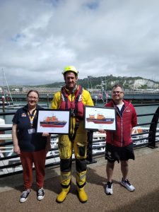 Dover RNLI sent this photo of them receiving prints of their current and former lifeboats.